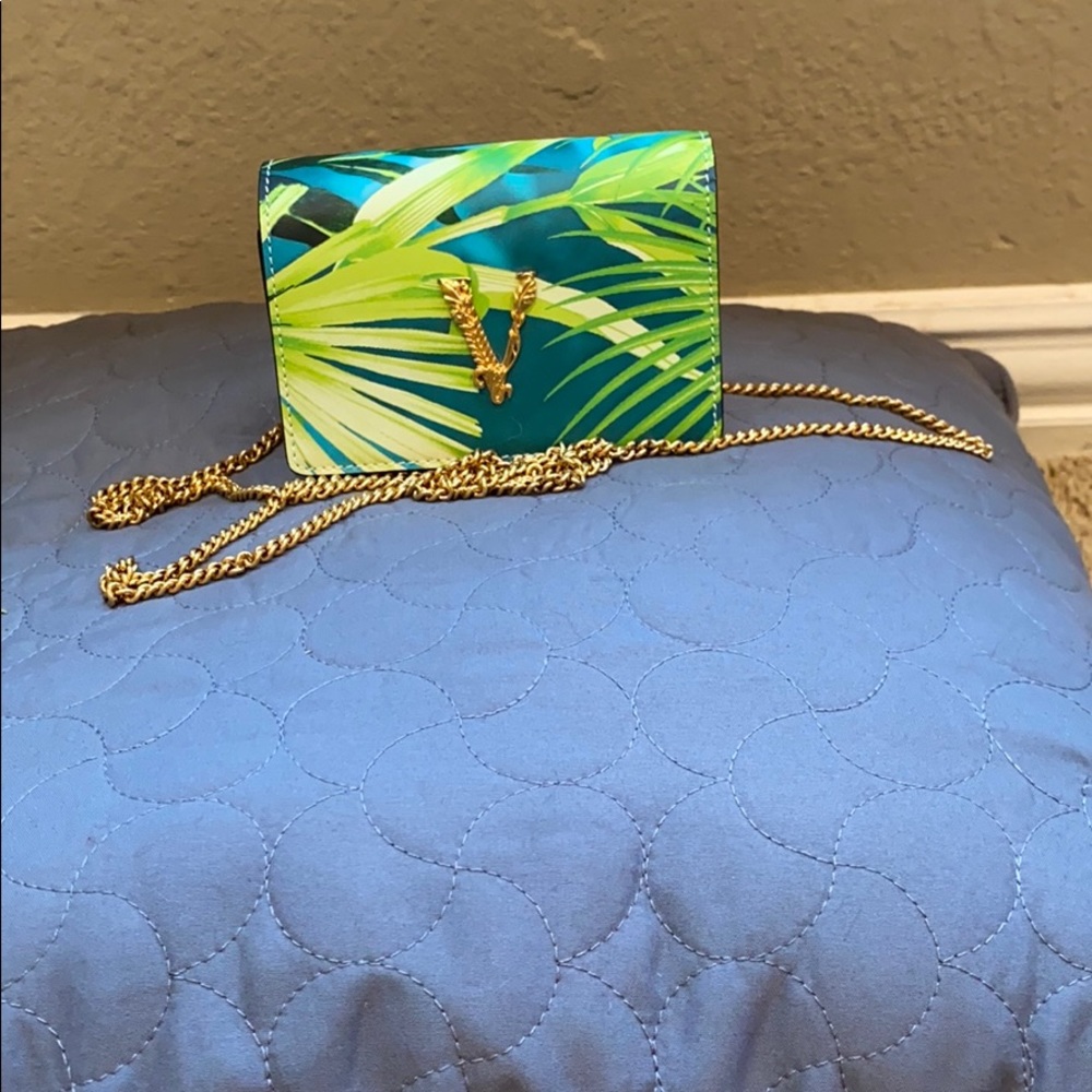 Versace tropical print mini chain bag $630.